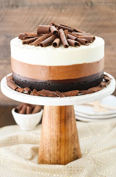 This Triple Chocolate Mousse Cake is an amazing combination of chocolate cake, chocolate fudge, and chocolate and white chocolate mousse! Smooth and creamy layers of mousse on top of a rich, moist cake. It's so freaking good! #triple #chocolate #mousse #cake #triplechocolate #moussecake #chocolatecake #triplechocolatecake #chocolatemoussecake #bestchocolatecake Triple Chocolate Mousse, Triple Chocolate Mousse Cake, Chocolate Mousse Cake Recipe, Fudge Chocolate, Mousse Cake Recipe, Triple Chocolate Cake, Rich Cake, White Chocolate Mousse, Layer Cake Recipes