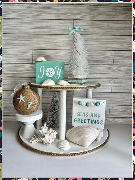 Looking to bring coastal vibes indoors this winter? Check out these 7 winter beach home decor ideas that will transform your space into a seaside retreat. From nautical accents to cozy throws, these decor tips will have you dreaming of sandy shores all season long. Add a touch of the beach to your home with these inspiring ideas! Sea Christmas Decorations, Diy Coastal Christmas Decor, Beach Christmas Decorations Diy, Coastal Christmas Decorations, Beachy Christmas Decor, Seas And Greetings, Ocean Christmas, Toddler Bathroom, Beachy Crafts