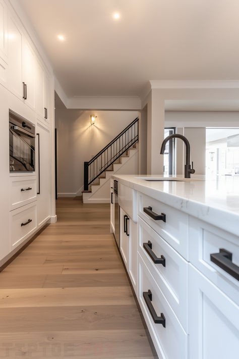 Kitchen Interior White And Black, White Kitchen Black Hardware Wood Accents, White Kitchen With White Walls, Black Handles White Cabinets, Kitchens With Black Hardware, White Kitchen Black Handles, Floors With White Cabinets, White Kitchen Cabinets Black Hardware, White Kitchen Black Hardware