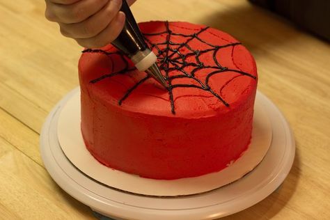 The thought of spiderwebs on a cake may conjure up unpleasant images, but if a cake is decorated with Spider-Man-styled frosting webs, that changes the story. Make a Spider-Man birthday party complete by decorating a cake that would make the superhero proud. To ensure your success, get the right tools to make cake decorating easy. With a little... Birthday Cake For Men Easy, Spiderman Torte, Geek Cake, Cupcakes Images, Cake Superhero, Turtle Cakes, Pirate Cakes, Minion Cakes, Flori Fondant