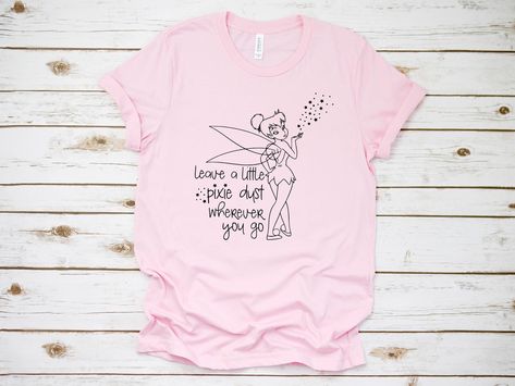 Peter Pan Disney World, Tinkerbell Pixie Dust, Tinkerbell Shirt, Peter Pan Disney, Nerdy Outfits, Disney Tinkerbell, Family T Shirts, Funny T Shirt Sayings, Disney Trip Shirts