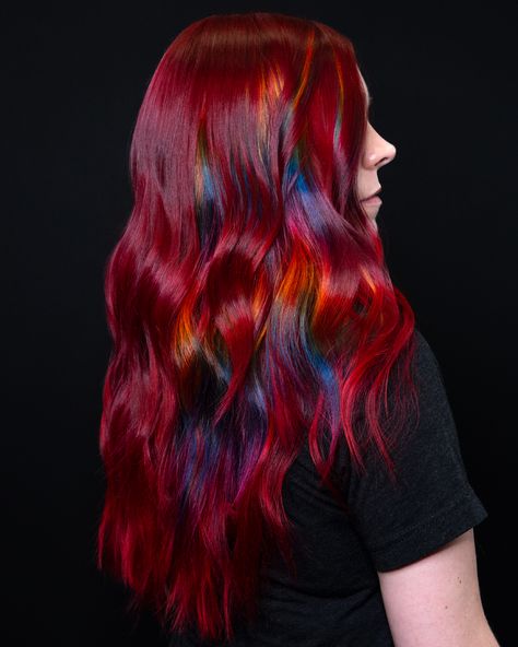 Elevate your hair game with this stunning color trend! Ruby red hair with prism pieces is the perfect blend of deep, rich tones and playful rainbow highlights. The ruby red base provides a luxurious and intense color, while the prism pieces add a unique rainbow effect that catches the light beautifully. Perfect for those who love to experiment with their look and want a hairstyle that's both bold and fun. Prism Hair, Ruby Red Hair, Rainbow Highlights, Fantasy Hair Color, Unicorn Hair Color, Vivid Hair, Pulp Riot Hair Color, Hair Color Orange, Vivid Hair Color