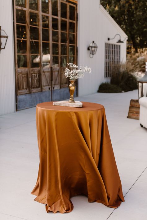 This wedding color palette is epic! Burnt orange, rosewood, cream, gray and blues, light orange, whites, and creams were perfect combinations. All the colors were generously spread out between the wedding reception decor, and wedding ceremony. So I can only conclude that the secret to livening up autumnal weddings weddings is blending in all the right colors. Hydrangeas, roses, mums, and carnations were also used to give a textured look for this fall wedding | Erin Morrison Photography Fall Wedding Cocktail Table Decor, Burnt Orange Party Decor, Burnt Orange Weddings Decorations, Farewell Dance, Cocktail Table Decor, Neutral Wedding Decor, Marble Quarry, White And Gold Wedding Cake, Spring Wedding Color Palette