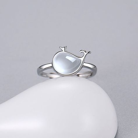 This silver ring features a charming whale design made with white chalcedony. Matching necklace, earrings, and bracelet are also available for a complete set. #SilverJewelry #WhaleRing #Chalcedony #MatchingSet #ElegantDesign #OceanInspired Whale Jewelry, Whale Design, Ocean Jewelry, Themed Jewelry, Semi Transparent, Ocean Inspiration, Elegant Accessories, Matching Necklaces, White Stone