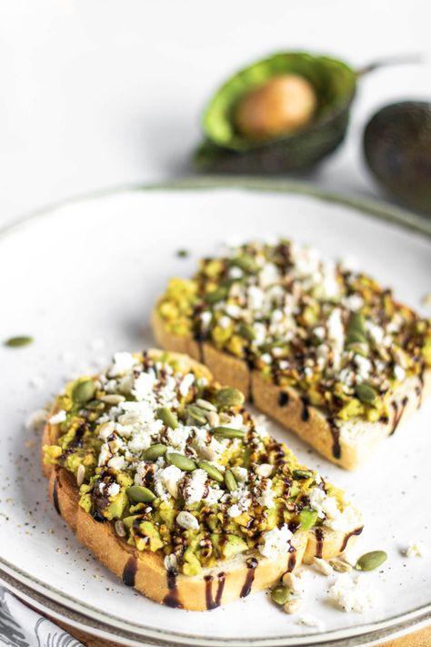 Avocado Toast with Feta Cheese and Balsamic Glaze Avocado Toast With Feta, Loaded Avocado, Breakfast Shakes Healthy, Balsamic Drizzle, Avocado Recipes Breakfast, Feta Cheese Recipes, Lunch Inspiration, Sambal Oelek, Avocado Toast Recipe