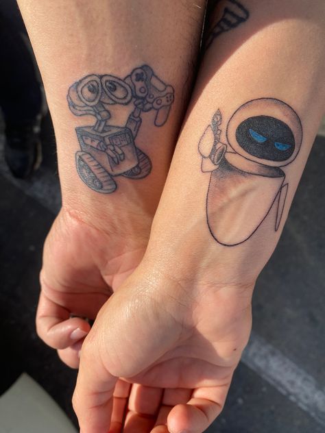 Wall-e and Eve Matching Tattoos Couples Cartoon, Wall E Matching Pfp, Wall E And Eve Matching Pfp, Wall E And Eve Tattoo, Walle And Eve Tattoos, Wall E Tattoo, Cute Couple Tattoo Ideas, Cute Couple Tattoo, Eve Tattoo