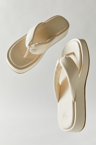 Thong-style sandals from UO with a puffy strap for plush comfort. Content + Care. Polyurethane, rubber Spot clean Imported Size + Fit. True to size Flat Form Sandals, Sandals Aesthetic, Heels Design, Pool Sandals, Shopping On A Budget, Shoe Shopping, Cute Shoes Heels, Bridal Heels, Platform Slippers