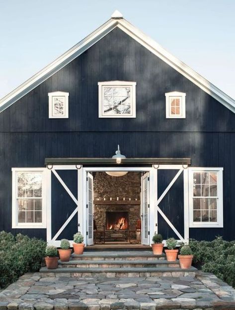 a navy and white barndominium with sliding doors and white framed windows looks very welcoming Rustic Farmhouse Exterior, Homes Farmhouse, Barn Living, Hale Navy, Fresh Farmhouse, Barn Interior, Black Barn, Metal Barn, Farmhouse Barndominium