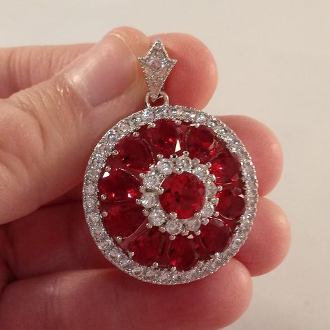 Beautiful Classic Luxury Design Ruby Red Zircon Layered Flower Amulet Statement Pendant 18k White Gold Filled W/ Ten Large Sparkling Pear Tear Or Water Drop Shape + Large Round Center Ruby Red Zircon + Clear White Round Simulated Diamond Topaz Zircon Gemstones + A Round Zircon Stone On The Designer Bail. Top Quality, High Polished Shine, Brand New, Never Been Worn. Lead, Nickel Free. This Gorgeous Pendant Sparkles. Perfect Jewelry Gift For Any Special Occasion, Wedding Anniversary Banquet Dating Ruby Amulet, Stone Statement Necklace, Layered Choker Necklace, Zircon Necklace, Spike Necklace, Opal Pendant Necklace, Red Pendants, Black Bead Necklace, Pendent Necklace