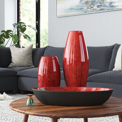 Showcasing bold colours and exquisite details, this set of decorations includes two vases and one bowl. Each piece features a stunning panela red finish with black accents. This three-piece set is extremely versatile: display the pieces together or separately in a bedroom, living room, dining room, hallway, or office. Black And Red Office Decor, Red Accent Interior, Red Accents In Living Room, Red Vase Decorating Ideas, Red Dining Room Table, Red Office Decor Ideas, Red Theory, Red Living Room Decor, Red Home Accessories