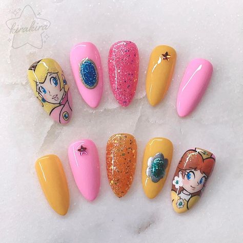 All Posts • Instagram Princess Daisy Inspired Nails, Princess Peach Nail Design, Princess Peach Nail Art, Princess Peach Inspired Nails, Princess Daisy Nails, Splatoon Nails, Princess Peach Nails, Super Mario Nails Art, Bowser Nail Art