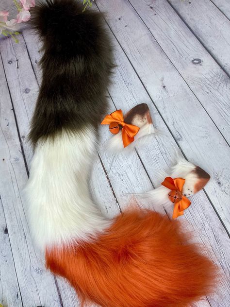 Premade Fall / Halloween Themed Calico Spot Cat Ears and Tail set  Ivory Faux Fur base with Ginger and Brown spots! Spot patterns vary :)   - Bows are optional and come on clips.  Long curved calico cat tail with sewn in belt loop and waist tie ribbon. My shop's ears and tails are completely hand crafted and might have some slight differences in trimming and airbrushing. Processing times:  Made to order: 4 weeks READY TO SHIP: 1-3 days ** Premade orders will be labeled as "PREMADE" if the listing is not labeled as "PREMADE" that means they are MADE TO ORDER!  ** If you need your ears sooner, please message me and we can work on setting up a RUSH ORDER for your desired date! Thank you! Rush fee is available to expedite the PROCCESING TIME not the Shipping time! :) ** PLEASE NOTE: CUSTOMIZAT Cat Ears And Tail Set, Ears And Tail Set, Cat Ears And Tail, Therian Stuff, Spotted Cat, Ears And Tail, Tie Ribbon, Spots Pattern, Scene Kids