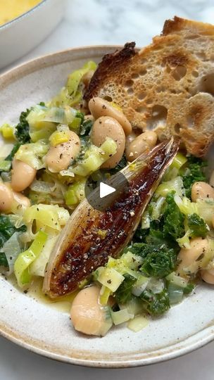 120K views · 649 reactions | Your new go-to comfort dish - Roasted Shallots, Leek & Butter Beans 💫

Beans are having a moment and we’re here for it! With creamy butter beans, caramelised roasted shallots, leeks, fresh lemon and a silky sauce to bring it all together, this recipe is super simple yet incredibly satisfying. We think it’s best mopped up with hunks of crusty sourdough 🌱

Here’s what you’ll need:
 
5 shallots, quartered lengthways, keeping the root intact and the skin on
3 tablespoons olive oil
4 cloves garlic, skin on
1 teaspoon thyme leaves finely chopped
pinch of dried red chilli flakes (to taste)
2 leeks, sliced
1 x 400g tin butter beans
2 handful of kale
2 handful of spinach, roughly chopped
1 tablespoon white wine vinegar
1 lemon, zested
pinch of sea salt & black pepper Roasted Shallots Leeks Butter Beans, Roasted Shallots, Bean Dishes, Beans Beans, Bean Snacks, Lentils Beans, Deliciously Ella, Healthy Menu, Vegan Bowls