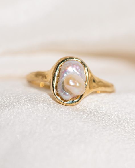 An illustrious ethereal talisman featuring a stunning freshwater Keshi Pearl, with a secondary baby Pearl growing out of it. This dreamy Pearl has a Sacred Mother energy embodying unconditional love and Divinity, reminding you that you are a miraculous vessel of love. You are a treasure. 14k Yellow Gold, one of a kind. *Please note the delicate nature of Pearls and treat them mindfully and with a gentle touch. 💌 Please write desired size (between 4-8) in *Notes* section at checkout Pearls are the June birthstone, representing purity, innocence, humility and love, and are created from the result of a living Being choosing to self-nurture itself, thus wholly embodying the watery, lunar Cancerean energy. The only gem created through a conscious and nurturing process in partnership with a liv Mother Energy, Baby Pearls, Freshwater Pearl Ring, Gold Ring Sets, Gentle Touch, June Birthstone, Keshi Pearls, Ring Setting, Special Jewelry