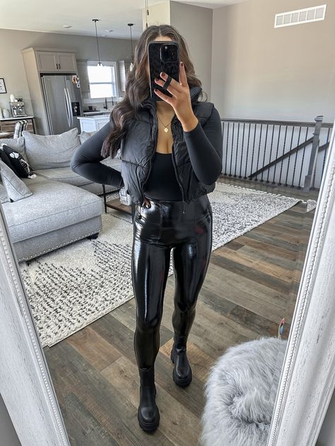 Latex Leggings Outfit Winter, Leather Leggings Chelsea Boots Outfit, Black Long Sleeve Bodysuit Outfit, All Black Outfits Casual, Chunky Black Boots Outfit, Liquid Leggings Outfit, Patent Leather Leggings Outfit, Puffer Vest Outfit Black, Black Cropped Puffer Vest