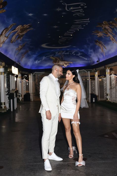 This couple is giving all the Las Vegas vibes at the White Chapel. I loved doing the bride's glam Hollywood waves which fit the vibe perfectly. Get inspired by las vegas elopement dresses short, las vegas wedding hair, soft hollywood waves and hollywood waves aesthetic. Book me as your Las Vegas elopement hairstylist at tiangcohair.com    // Photo by @riskyexposurephotography on IG Elopement Poses, Editorial Elopement, Vegas Wedding Dress, Chapel Elopement, Las Vegas Bride, White Wedding Chapel, Romantic Bridal Hair, Las Vegas Wedding Photos, Vegas Bride