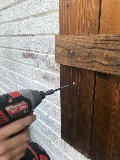 My husband and I looked for different ways to hang our DIY wood shutters onto our brick house, and there were quite a few different options that we came across. It got slightly confusing, so I thought I’d share what we decided to do and what worked for us.I’d like to note that we are not pros, but this is what we found to work for us. We started by holding the shutter up where we were planning to hang it on the house. From there, we marked the shutter where the mortar line on the hou… Diy Shutters Exterior Brick Homes, How To Hang Shutters On Brick, How To Make Shutters, Wood Shutters On Brick House, Shutters Brick House, Diy Wood Shutters, Shutters Diy, Wood Shutters Exterior, Door Shutters