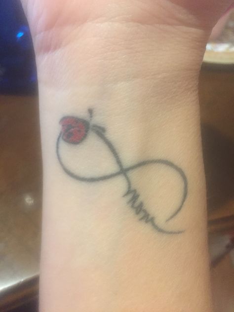 Beautiful ladybug and infinity symbol wrist tattoo.  I used my mother's signature, which is the best part <3 Infinity Tattoo With Ladybug, Ladybug Tattoo With Name, Ladybug Tattoo On Wrist, Ladybug Wrist Tattoo, Polynesian Tattoo Meanings, Ladybug Tattoo, Meaningful Wrist Tattoos, Lady Bug Tattoo, Bug Tattoo