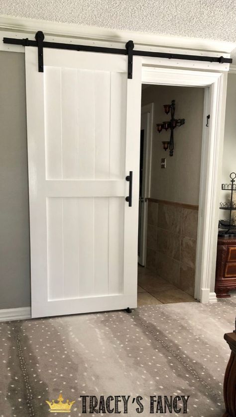 Our new DIY sliding barn door! As in…..bye-bye-non-descript-always-annoying pocket door! - By Tracey's Fancy DIY | DIY Barn Door | Pocket Door Makeover | Bedroom Makeover | DIY Bedroom Makeover | Barn Door | Farmhouse Barn Door | Sliding Barn Door | Farmhouse | Farmhouse Style | DIY Farmhouse Barn Door | Dixie Belle Paint | Painted Barn Door | Painted Sliding Barn Door | White Barn Door #traceysfancy #barndoor Farmhouse Slider Door, Hallway Sliding Doors, Farmdoors Bedroom, Diy Farmhouse Sliding Door, Farmhouse Doors Sliding, Barn Door Pattern, Farmhouse Bathroom Door Ideas, Black And White Barn Door, White Barn Doors Sliding