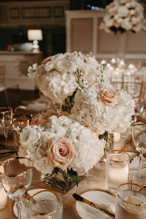 We chose white and light pink rose wedding flowers with baby’s breath for Madison and John’s elegant wedding centerpieces and wedding table décor. Their classic wedding aesthetic and timeless wedding décor included their elegant wedding flowers and white and gold wedding table décor. We offer luxury wedding planning in Nashville and worldwide. Nashville wedding venue indoor, old money wedding, elegant wedding reception, chic wedding, classy wedding, elegant wedding florals Cream Wedding Aesthetic, White And Gold Wedding Table, White And Champagne Wedding, Wedding Flower Table Decorations, Timeless Wedding Decor, Elegant Wedding Colors, Pink Rose Wedding, Romantic Wedding Centerpieces, Money Wedding