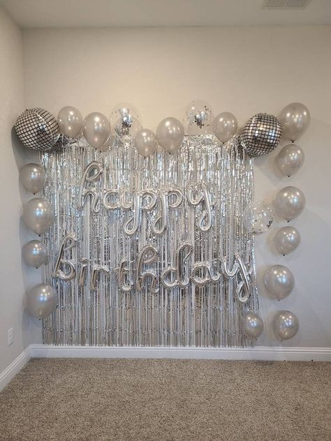 "We highly recommend hanging with painters tape to avoid damage to wall. The tape can be covered with Balloons or decorative items.  Kit Includes: -2 piece Foil curtain set (each Curtain measures 1 meter x 2 meters -2 Disco Ball Balloons -3 Silver Confetti  Balloons -Happy Birthday Balloon Banner -Silver Latex Balloon Assortment 12\" and 10\" ⓘ Fishing line, tape, command hooks, ribbon, and additional hanging items are not included unless stated otherwise. Balloons will arrive flat and deflated. Silver And Gray Birthday Theme, Birthday Decorations With Pictures, Party Items Decorations, Silver Year Birthday, 18th Birthday Set Up Party Ideas, Disco Ball Backdrop Photo Booths, 22nd Birthday Backdrop Ideas, Silver 21st Birthday Decorations, Simple Birthday Wall Decor