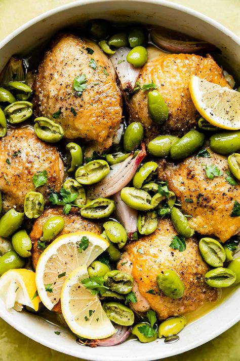 This Castelvetrano Olive Chicken Skillet is weeknight dinner magic: a 5-ingredient, one-skillet recipe ready in 40 minutes or less! Simply roast chicken thighs with olives, shallots, & lemon, which creates a rich, briny, & bright pan sauce as it cooks. Minimum effort, maximum flavor! Serve the chicken and olives with tons of fresh herbs, lemon, & crusty bread for dipping. #olivechickenrecipe #chickenolivesrecipe #chickenthighrecipe #skilletmeals #skilletchicken #easydinnerideas #dinnerrecipes Castelvetrano Olives Recipe, Chicken And Olives, Roast Chicken Thighs, Olive Chicken, Healthy Lemon Chicken, Bread For Dipping, Castelvetrano Olives, Chicken Thighs Dinner, Chicken Skillet