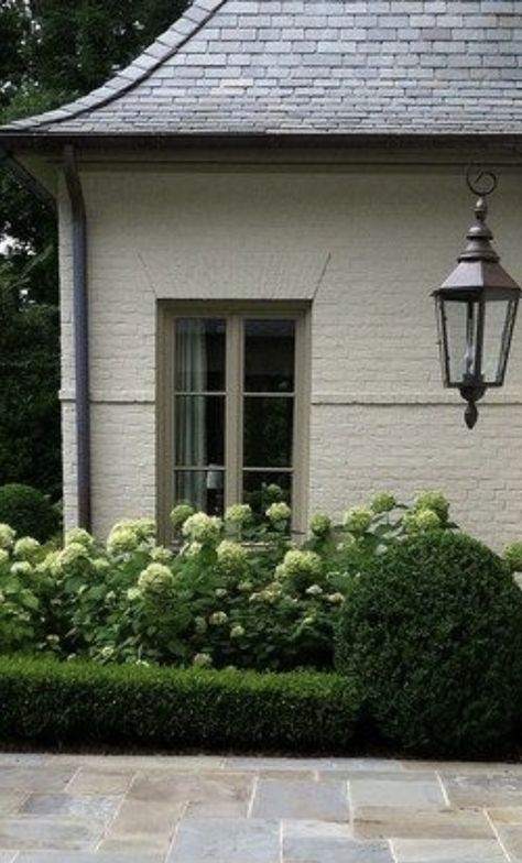 White Brick House With Grey Shutters, White Brick Shutters, Olive Green Shutters On Cream House, Cream House With Green Shutters, Creamy White Brick Exterior, Cream House Green Shutters, Cream Brick House Exterior Color Schemes, Cream Brick House Exterior, Cream House Exterior