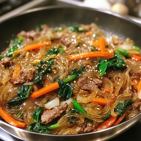 🍜 Try Japchae—Korean glass noodles stir-fried with vegetables and a sweet-savory sauce. A flavorful, satisfying dish! 😋🌟 #Japchae #KoreanNoodles Korean Glass Noodles (Japchae) Ingredients: Sweet potato noodles (8 oz) Beef (1/2 lb, thinly sliced) Carrot (1, julienned) Bell pepper (1, sliced) Onion (1, sliced) Spinach (1 cup, blanched) Soy sauce (1/4 cup) Sugar (2 tbsp) Sesame oil (2 tbsp) Garlic (3 cloves, minced) Sesame seeds (for garnish) Instructions: Cook sweet potato noodles according... Cook Sweet Potato, Korean Glass Noodles, Sliced Onion, Korean Noodles, Potato Noodles, Instagram Recipes, Sweet Potato Noodles, Glass Noodles, Cooking Sweet Potatoes