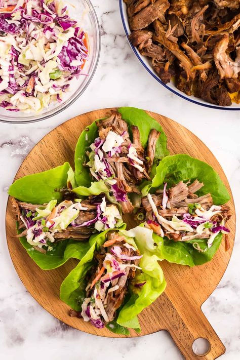 Our easy pulled pork lettuce wraps are mouthwatering and full of tender pulled pork. Low carb and packed with flavor our pulled pork is served on butter lettuce and topped with a keto-friendly BBQ sauce and coleslaw. Pork Low Carb, Pulled Pork Coleslaw, Pulled Pork Lettuce Wraps, Whole30 Pulled Pork, Pork Coleslaw, Pulled Pork Wrap, Coleslaw For Pulled Pork, Healthy Coleslaw Recipes, Whole Lotta Yum