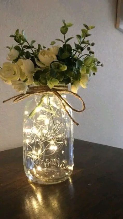 23 Mason Jar Wedding Centerpiece Ideas To Wow Your Guests - Social Expert Tips Mason Jar Centerpieces With Lights, Cheap Wedding Table Decor, Creative Wedding Guest Book Ideas, Creative Wedding Guest Book, Jar Centerpiece Wedding, Creative Wedding Guest Books, Mason Jar Flower Arrangements, Mason Jar Fairy Lights, Wedding Cheap