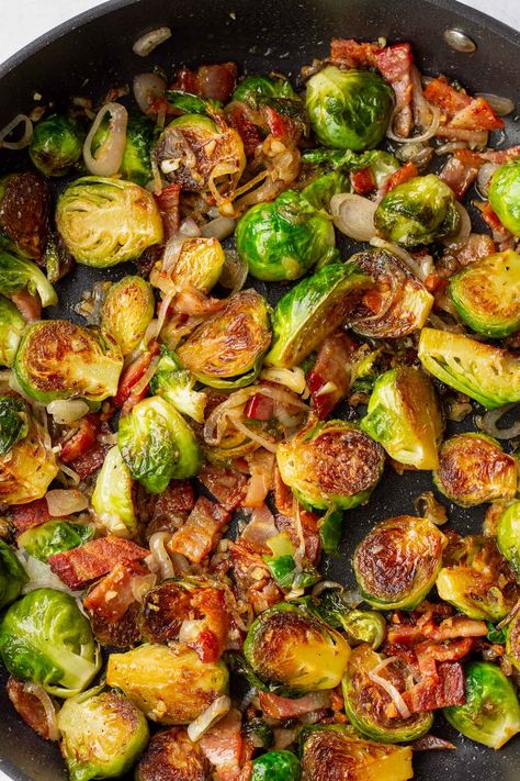 Sauteed Brussels Sprouts! These sauteed brussels sprouts with bacon, garlic, and shallots are the perfect side dish for any occasion, especially Thanksgiving. They caramelize beautifully and is drizzled with maple syrup. Bacon Onion Brussel Sprouts, Brussel Sprouts With Sausage, Veggies With Bacon, Brussel Sprouts Bacon Maple Syrup, Brussel Sprout Recipes With Bacon Thanksgiving, Maple Syrup Brussel Sprouts, Brussels Sprouts Sauteed, Brussel Sprout Dishes, Maple Brussel Sprouts With Bacon