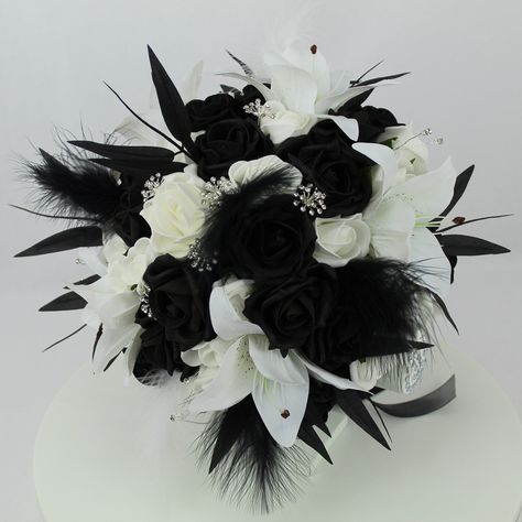 Custom Realistic Artificial Black & White wedding singles with feathers These bouquets have been custom made with quality silk, real touch & foam flowers & custom made diamante clusters and sprays. The bouquet handle has been wrapped with satin/diamante ribbon and come with colour coordinated satin bows.  These bouquets are available in 5 standard sizes & the cascading bouquet is available on a separate listing on our shop: Approximate sizes; Extra Large bouquet - 11 inches Large bridal bouquet - 9 inches Medium bridal bouquet 7 inches Small bouquet - 5-6 inches Flower girl wand 4-5 inches The matching cake topper and coronets are made with matching quality foam, silk & real touch flowers. The matching buttonhole has also been made with real touch flowers & custom made diamante spray & all Black And Gold Bridal Bouquet, Black And White Bridal Bouquet, White And Black Bouquet, Wedding Bouquet With Feathers, Black And White Wedding Theme Classy, Black And White Wedding Flowers, Black And White Wedding Bouquet, Black And White Bridal Party, Black Bridal Bouquet