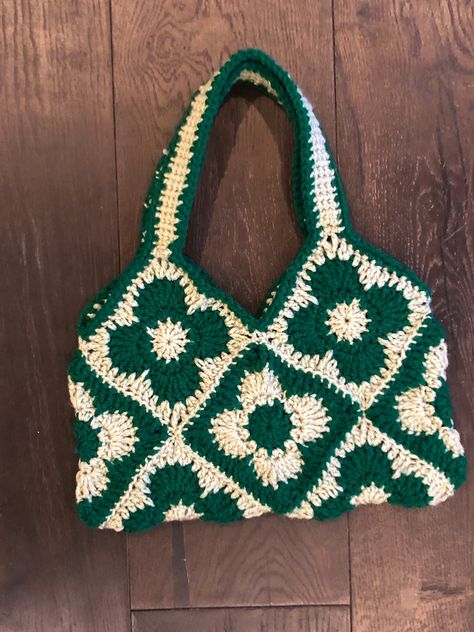 This funky bag is crocheted by hand with love. Made with 10 individual granny squares sewn together, this tote is perfect for a trip to target, a night on the town and everything in between. Every bag is carefully crafted with each customer in mind, to provide a high quality, gorgeous product.  The bag is roughly 11 by 6 inches.  Visit my storefront for more color options. Crochet Square Two Colors, 10 Granny Square Bag, Crochet Present For Grandma, Crochet Bag Granny Square Ideas, Crochet Bag Inspiration, Crochet Patterns Green, Granys Square, Two Color Granny Square, What To Do With Granny Squares