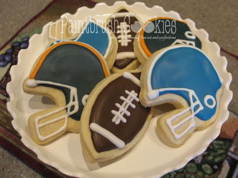 Decorated Football and Helmet Sugar Cookies Helmet Cookies Decorated, Football Sugar Cookies Royal Icing, Football Jersey Cookies Decorated, Football Helmet Cookies Decorated, Superbowl Cookies, Football Helmet Cookies, Fantasy Football Cookies, Eagles Football Helmet, Football Sugar Cookies