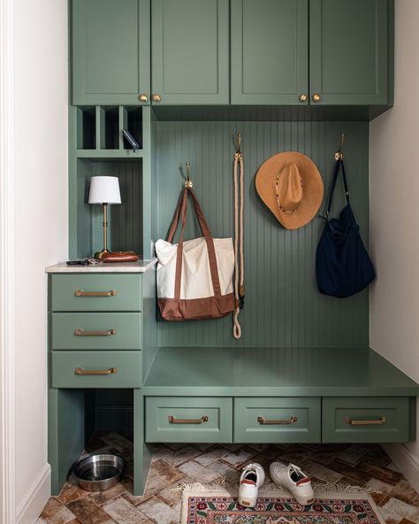 A mudroom designed with functionality in mind. @ellenreneephotos English Colonial Decor, Green Built Ins, Green Mudroom, Organized Mudroom, Brick Tile Floor, Small Mudroom Ideas, Matt Baker, Mudroom Cabinets, Home Command Center