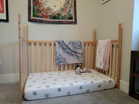 We have an older Dream On Me crib without the toddler bed conversion kit. Invested in a nice crib mattress that we can now use as a floor bed! Just remove the crib platform and fourth wall, flip upside down, and voila! Montessori Mattress On Floor, Turn Crib Into Floor Bed, Montessori Bed From Crib, Playpen Floor Bed, Ikea Crib To Floor Bed, Crib Mattress On Floor, Crib To Floor Bed Diy, Floor Bed Hack, Toddler Mattress On Floor