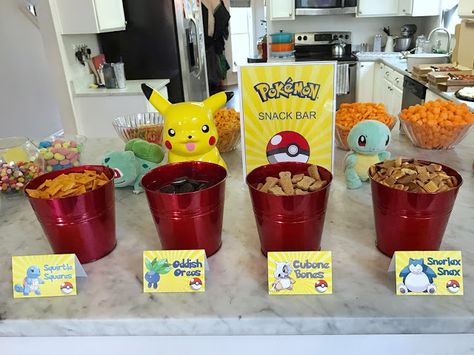 Pokemon-Themed 7th Birthday Party | Fab Everyday Pokemon Snack Bar Free Printables, Pikachu Party Food, Pokemon Snack Bar, Pokemon Snacks Ideas, Pokemon Food Labels, Pokemon Food Ideas, Pokémon Snacks, Pokemon Birthday Party Food, Pokemon Themed Food