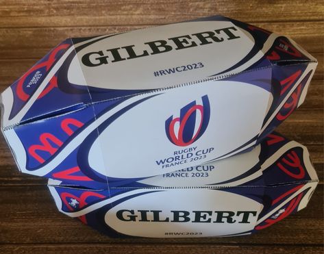 Rugby Ball shaped party box matching RWC 2023 match ball Gift Box Design Ideas, Box Design Ideas, Rugby Party, Rugby Gifts, Rugby World Cup 2023, Party Boxes, World Cup 2023, Rugby Ball, Gift Box Design