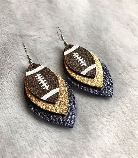 Leather football earrings, team colors, navy blue and gold, Notre Dame, Los Angeles Rams Cricut Earrings Football, Faux Leather Baseball Earrings Diy, Baseball Leather Earrings, Leather Football Earrings, Ohio State Faux Leather Earrings, Cricut Earrings, Tassel Sandals, Faux Christmas, Football Earrings