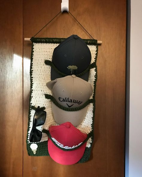 Wall hanging hat and sunglasses holder for my dad’s Father’s Day gift. He is an avid golfer and man with many hats. Peep the golf ball and tee in the left corner (yes it does also look like an ice cream cone haha) 🧢⛳️ • • • • #golf #fathersday #gift #dad #father #crochet #hat #hats #hatholder #golfhats #sunglasses #lifestyle #homedecor #organization #homeorganization Crochet Golf Accessories, Grandpa Crochet Gifts, Golf Crochet Patterns, Crochet Christmas Gifts For Men, Crochet Golf Ball, Crochet Hat Holder Pattern, Quick Crochet Gifts For Men, Men Crochet Gifts, Crochet Gift Ideas For Dad