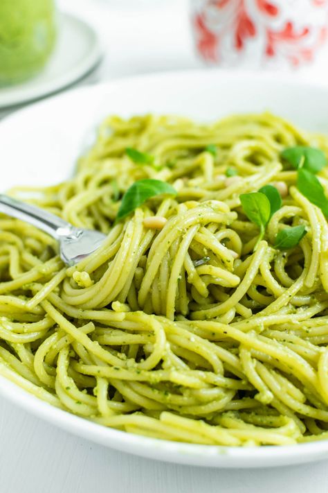 Avocado pesto pasta is a delightfully creamy dish loaded with avocado, fresh basil, olive oil, Parmesan cheese, lemon, garlic and pine nuts. You can have this pasta on your table in just 15 minutes, making it a simple dish perfect for a quick weeknight dinner. Add your favorite protein, load it up with veggies, or serve with a side of garlic bread to level this dinner up even more. #avocadopesto #avocadopestopasta #pestopasta #avocadopasta #weeknightdinner #easydinner #healthydinner Avocado Pesto Recipe, Avocado Pesto Pasta, Basil Olive Oil, Avocado Pasta, Avocado Pesto, Sauteed Zucchini, Cilantro Lime Chicken, Sauteed Veggies, Pesto Recipe