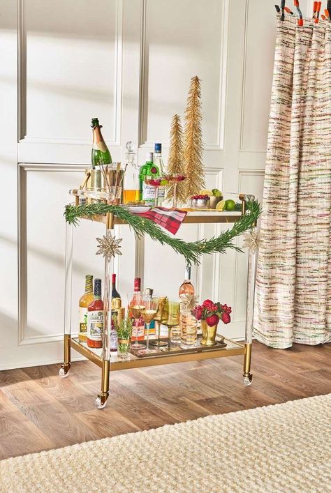 How to serve up a show-stopping bar cart. Follow these tips to create a Christmas refreshment display that will keep the holiday spirits flowing. #barcart #christmasdecor #holidaybarcart #holidayparty #southernliving Holiday Bar Cart Christmas, Christmas Bar Cart Styling, Porch And Patio Ideas, Small Front Porch Decorating Ideas, Christmas Bar Cart, Holiday Bar Cart, Boxwood Garland, Magnolia Garland, Porch And Patio