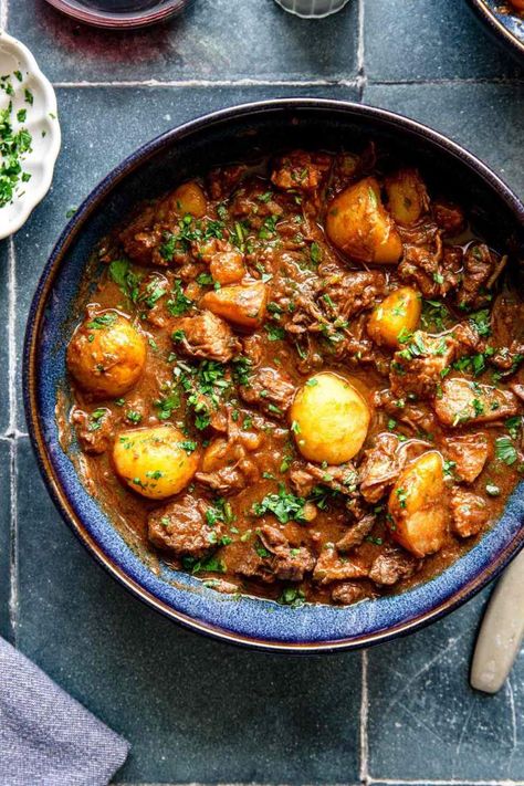 Slovenian Meat Stew, or Bograč, is a spectacular one-pot stew made with three types of meat: beef, game (deer), and pork. Soft, tender, and delicious. An amazing one-pot recipe filled with meat and potatoes - serve for a delicious family meal. It’s easy to make ahead, gluten-free and dairy-free. #bograc #stew #meat #deer #game #beef #pork #jernejkitchen #familymeal #onepotrecipes Caramel Slices, Slovenian Food, Meat Stew, Graham Cookies, Meat And Potatoes, Beef Shank, Stew Meat Recipes, Pork Stew, Delicious Family Meals