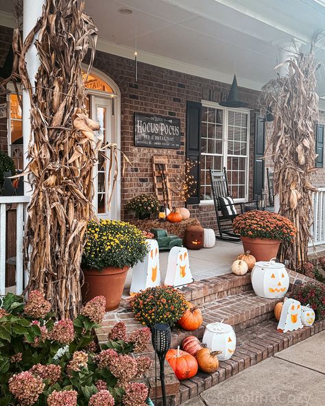 Does anybody else love to use cornstalks for their porch? This year, I really wanted to use some branches and put some faux fall leaves on it, but unless we go into a forest somewhere, I’m not finding any here around the lake! 😅 Swipe through to see my porch views, and comment LINKS to shop my Jacks, ghosts, and more! Take 25% off my Hocus Pocus sign with code CAROLINACOZY My white Jacks are on sale! 🙌 Happy Friday Eve y’all! Halloween front porch | Halloween decor | Halloween decor... Front Porch Halloween Decor, Porch Halloween Decor, Hocus Pocus Sign, Front Porch Halloween, Porch Halloween, Happy Friday Eve, Friday Eve, Halloween Front Porch Decor, Halloween Front Porch