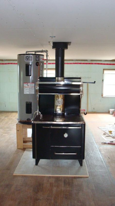 Consider a Wood Burning Cookstove for Your Off-Grid Kitchen - Off Grid and Free: My Path to the WildernessOff Grid and Free: My Path to the Wilderness Outdoor Kitchen Off Grid, Off Grid Kitchen, Wood Stove Cooking, Pressure Canner, Water Storage Tanks, How To Make Fire, Cooking Stove, Sustainable Community, Kitchen Stove