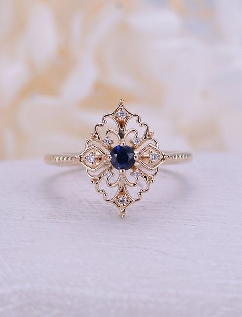 Art deco engagement ring Vintage Sapphire engagement ring rose gold Floral Unique Diamond wedding women Bridal set Anniversary gift for her Description: - Vintage style Sapphire and diamond ring - Natural Conflict free diamonds - comfortable band Sapphire carat:approx3.5mm(0.2CT) Vintage Sapphire Engagement Ring, Art Deco Engagement Ring Vintage, Sapphire Engagement Ring Rose Gold, Unique Diamond Wedding Rings, قلادات متدلية, Vintage Engagement Rings Art Deco, Vintage Engagement Rings Sapphire, Anniversary Art, Tiara Ring