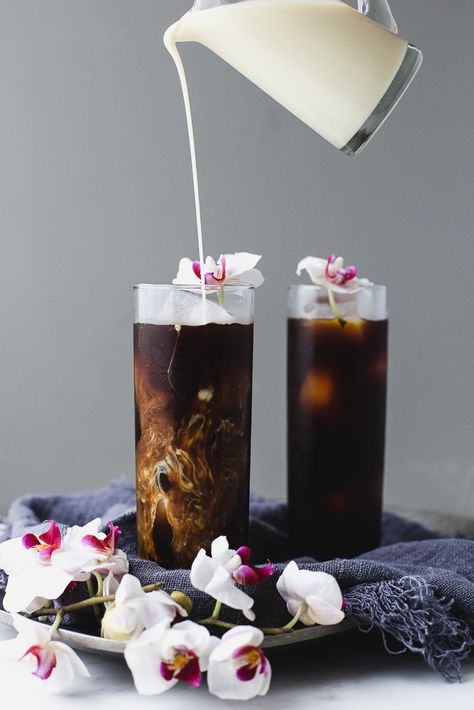 Make This Easy Cardamom Cold Brew Vietnamese Coffee ASAP | This is how you turn the volume up on regular iced coffee. After 24 hours you can strain the coffee through a colander lined with a double layer of cheesecloth into a pitcher. To make the vanilla cream, simply pour some sweetened condensed milk, half-and-half, and vanilla extract in a Mason jar and shake it up. When you're ready to serve the coffee, pour the cold brew concentrate into ice-filled glasses, and top with the vanilla cream. The Modern Proper, Modern Proper, Iced Coffee Drinks, Vietnamese Coffee, Iced Drinks, Vanilla Cream, Cold Brew Coffee, Non Alcoholic Drinks, Coffee Love