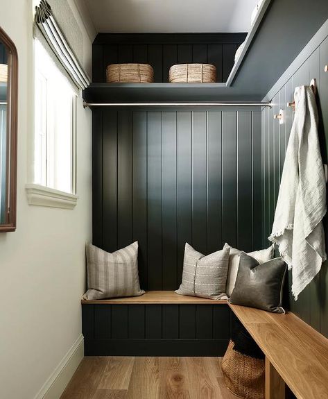 An l-shaped wood top mudroom bench is fixed against a black shiplap backsplash under a tension rod and brass hooks fixed under an l-shaped black shelf. Cottage Laundry Room, Waterfront Cabins, Laundry Room Ideas Small Space, Mudroom Bench Seat, Lake Winnipesaukee, Lake Cabin, Laundry Room Diy, Small Laundry Rooms, Hallway Ideas Entrance Interior Design