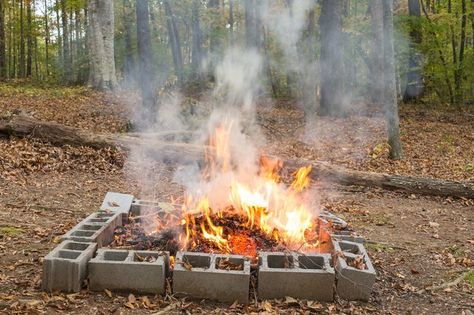 How to Burn Yard Waste - With the right preparation, careful location and proper dousing, you can burn effectively without letting the fire get away. Wood Floor Stains, Burn Barrel, Cinder Blocks, Protecting Yourself, Gardening Gear, Stone Fire Pit, Safety Precautions, Garden Fire Pit, Yard Waste