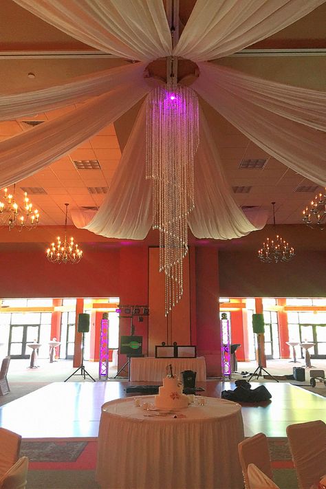 Discover a stunning ceiling draping with soft lighting for your big day.#WeddingDecorIdeas #WeddingCeilingDecor #CeilingLights Modern Wedding Theme, Ceiling Draping, Reception Backdrop, Wedding Lighting, Enchanted Wedding, Elegant Chandeliers, Decorative Lighting, Ceiling Decor, Lighting Inspiration